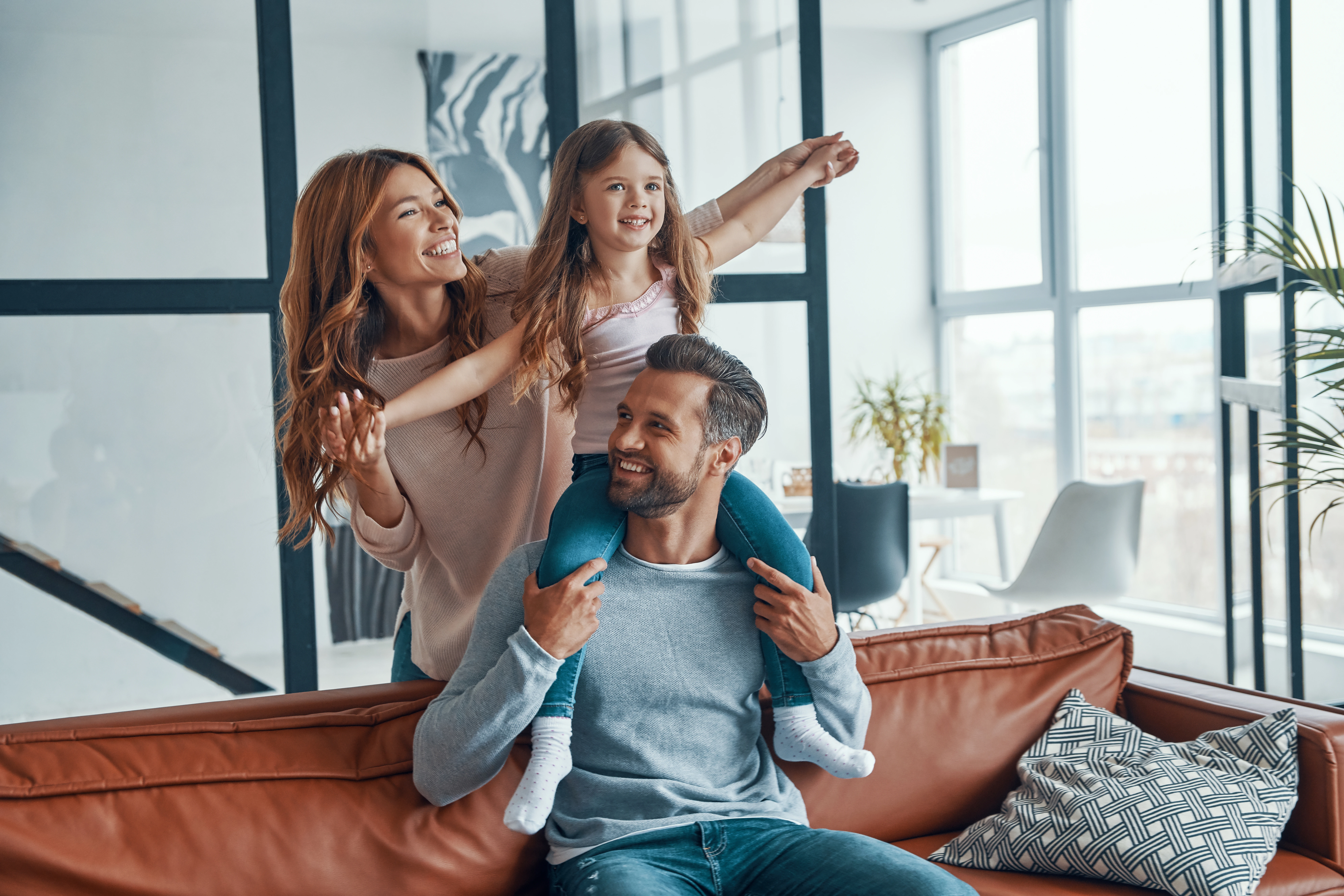 Happy Young Family Bonding Together Home